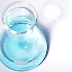 Top down shot of beaker containing AiroPure® Odour Eliminator Solution.